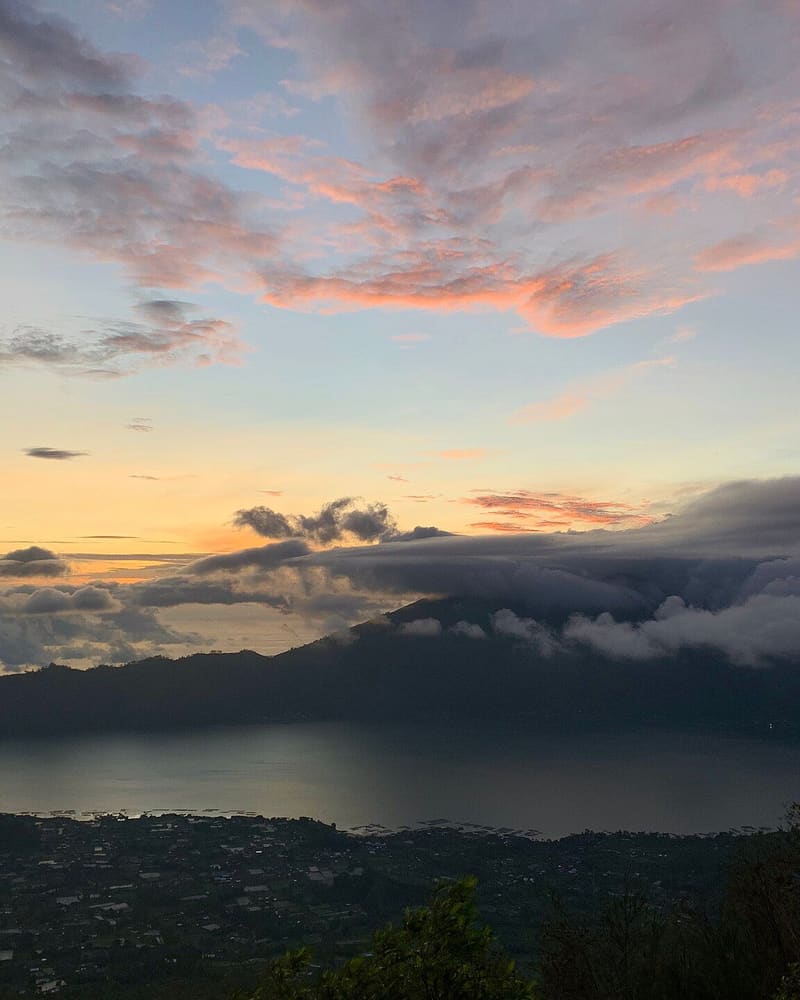 Sunrise over Lake Batur and Mount Abang seen from the slopes of Mount Batur, Bali