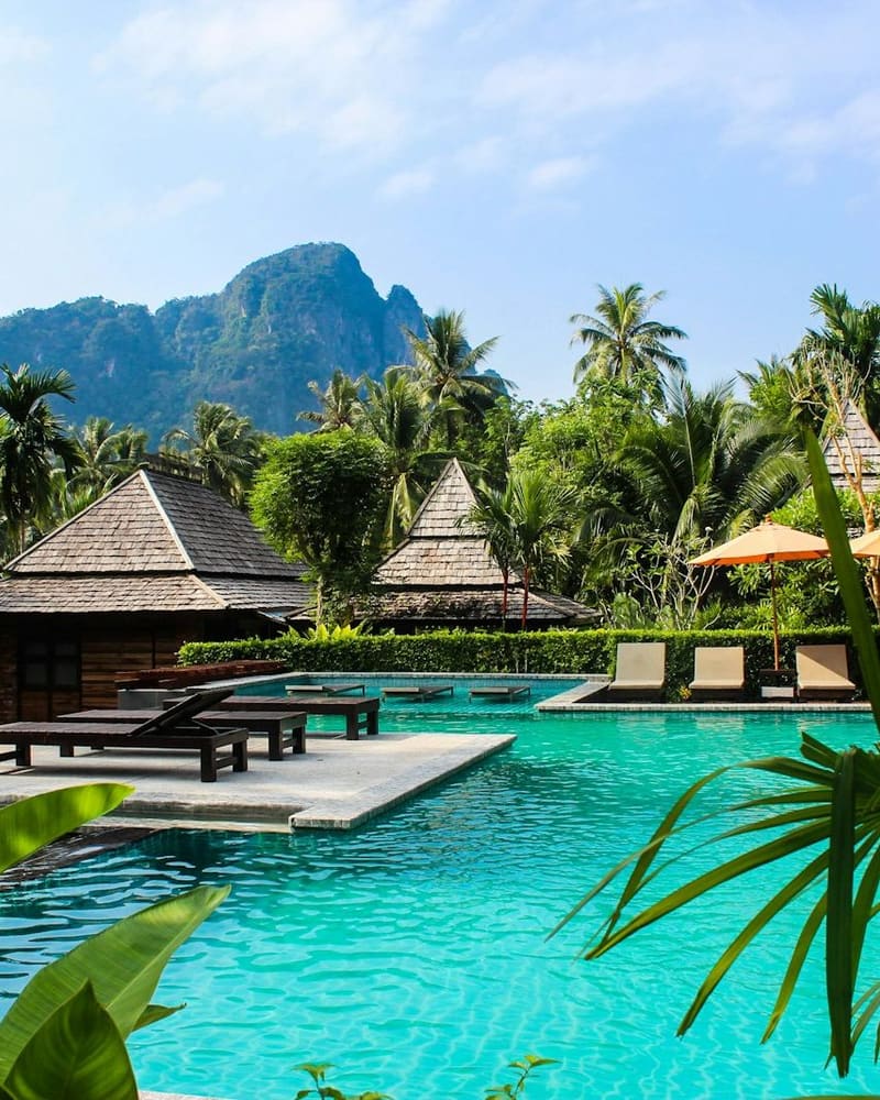 Representative luxury poolside setting; not an official photo of the VIP bed